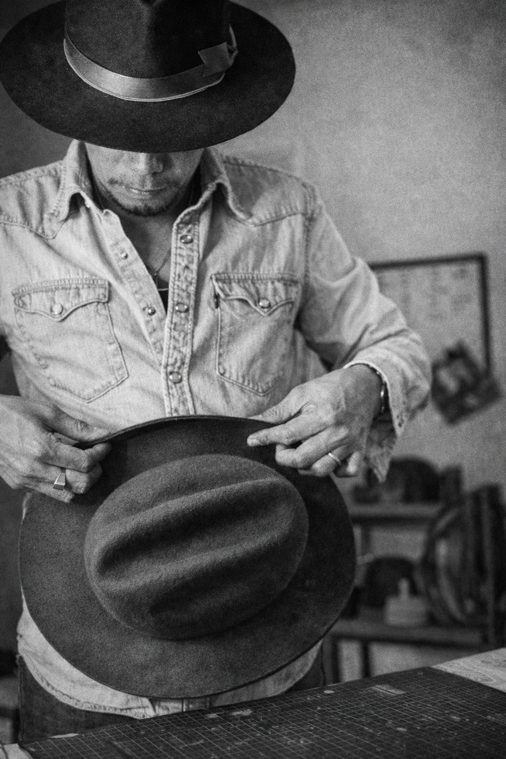 Nino shaping a felt hat
